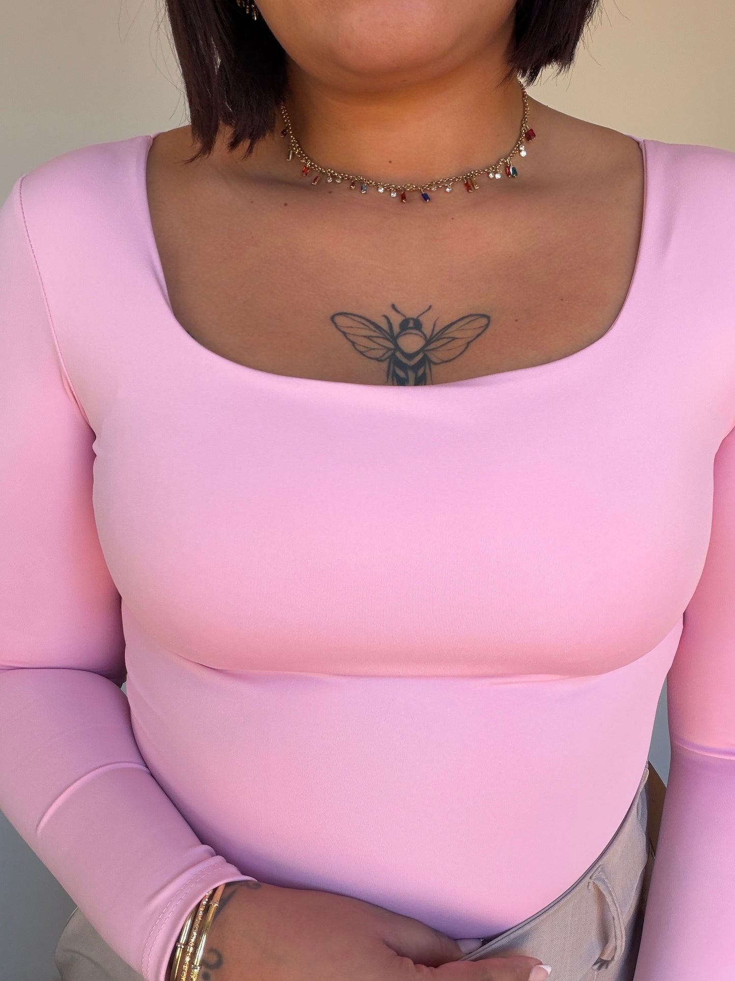 Body de manga larga en color rosa pastel suave para mujer 